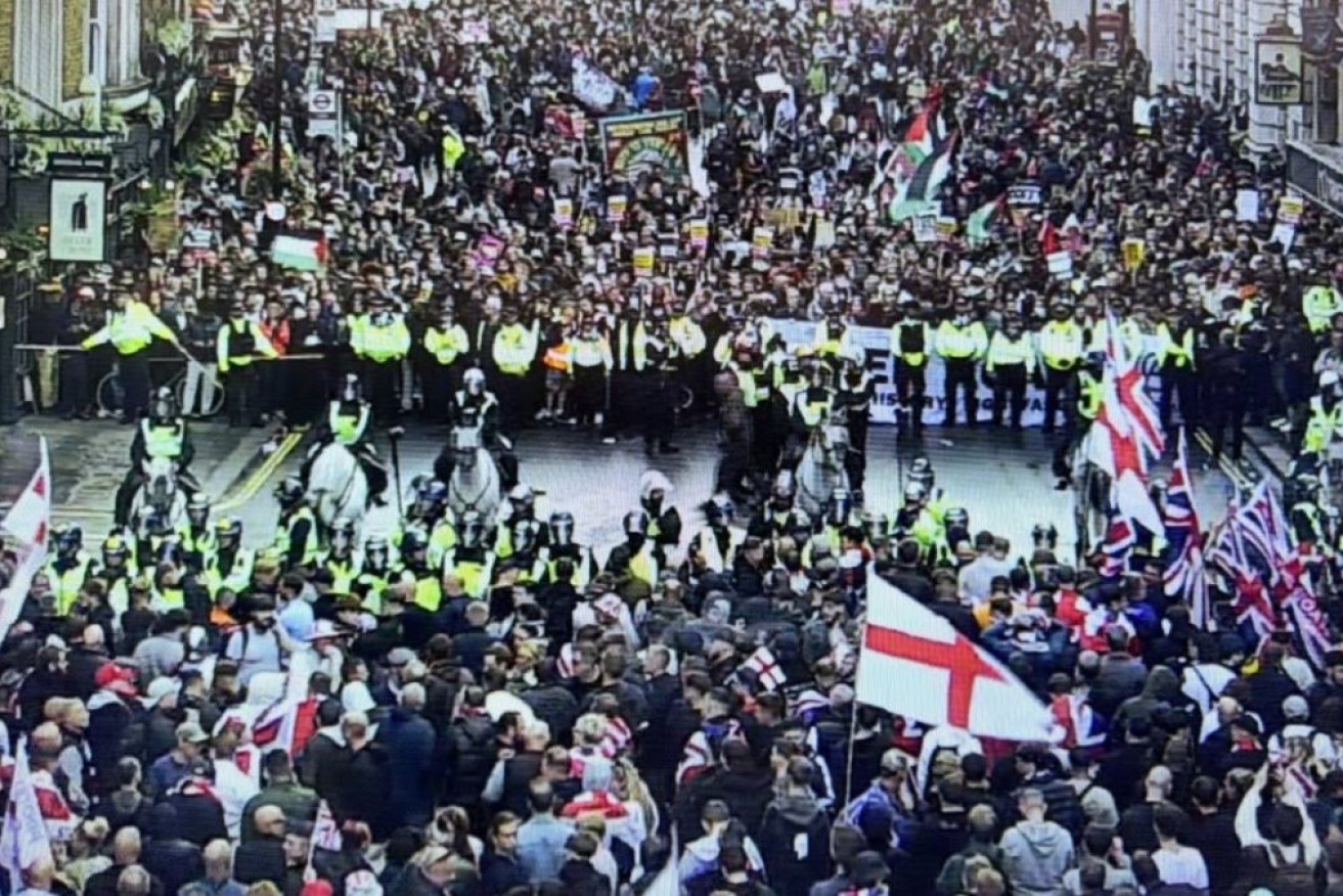 Police trying to maintain a separation between rival protest groups in London.