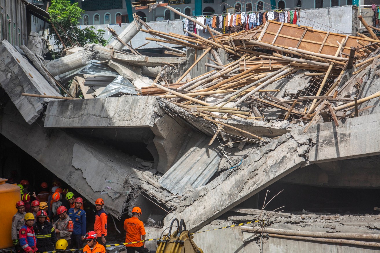 The school in East Java, Indonesia had been undergoing an unauthorised expansion when it collapsed.
