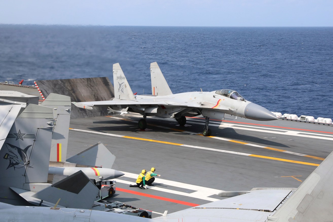 A Chinese fighter jet set off flares near an RAAF plane, the Australian government says.