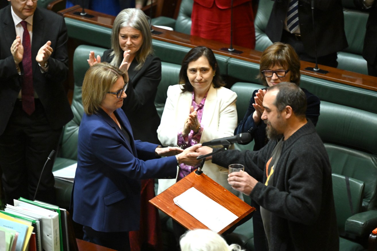 Jacinta Allan and Rueben Berg of the First Peoples' Assembly have signed the treaty agreement.