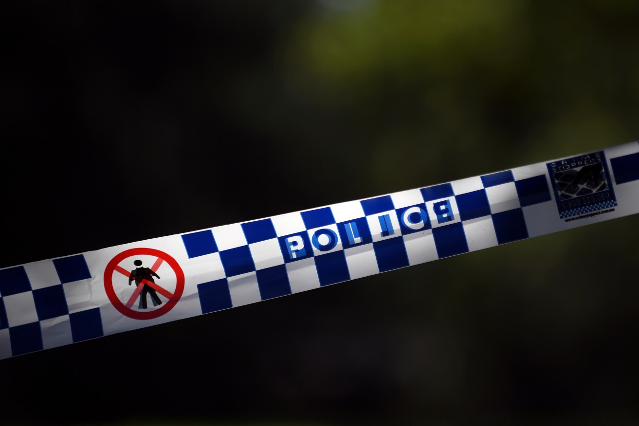 A teenage boy has died and another is in custody after a stabbing attack near a high school.