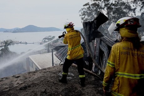 Firefighter dies as residents stay on high alert