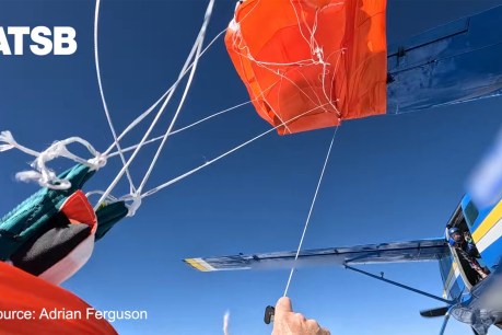 Skydiver hangs from plane tail, snared by own chute