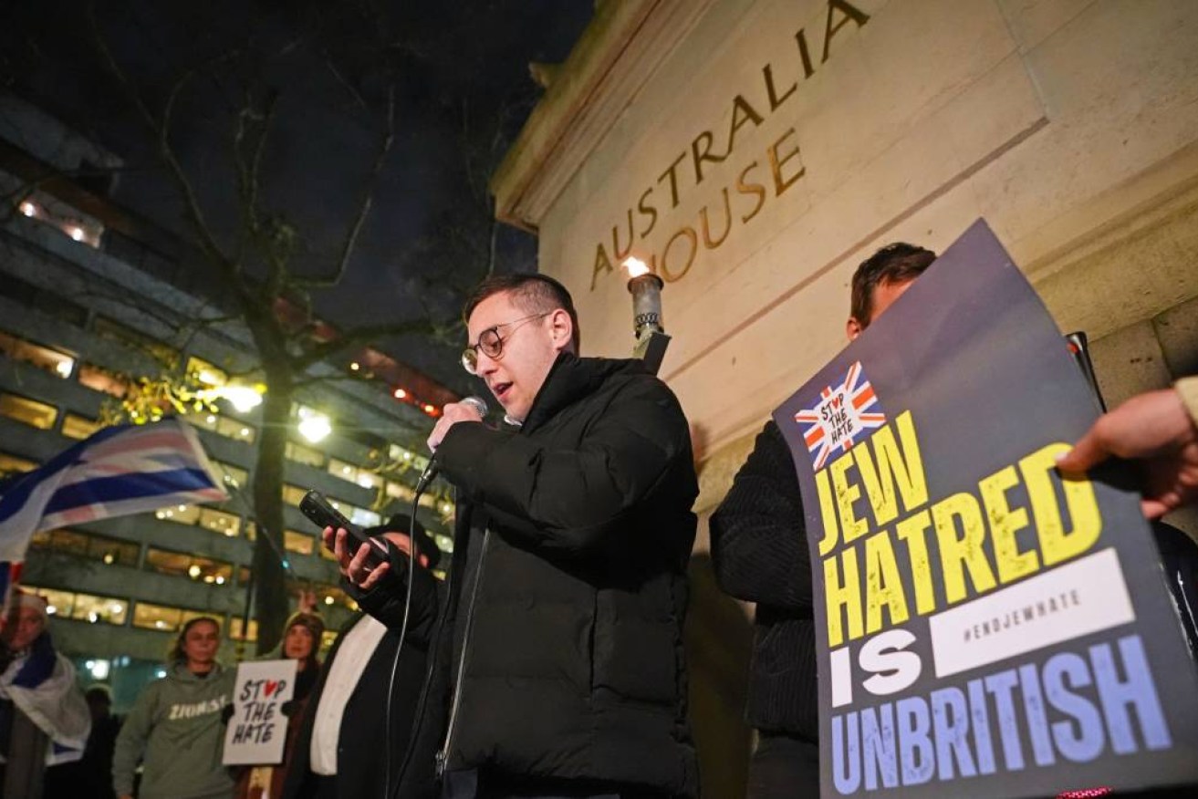 Attendees at the vigil cheered for a "hero" who was filmed tackling a gunman.