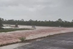 Man dies in floodwaters amid record deluge