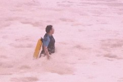 Search for swimmer, as woman found dead