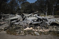 350 structures lost in bushfire as victim named