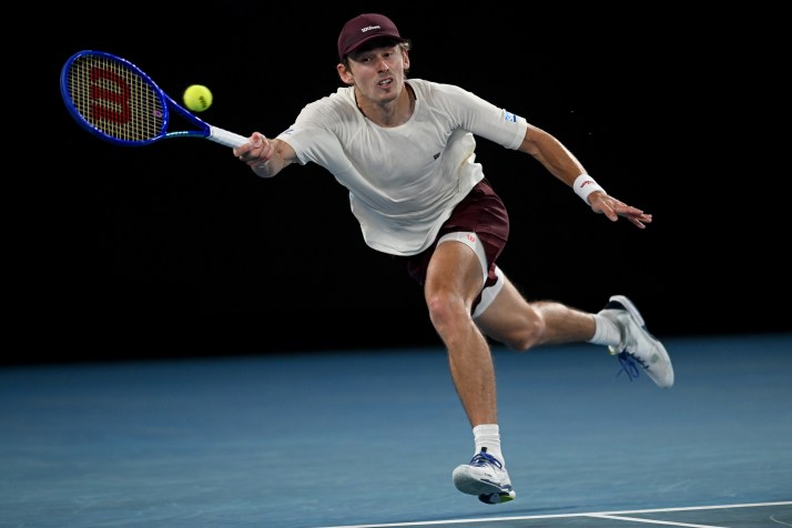 De Minaur overcomes big-serving rival to advance