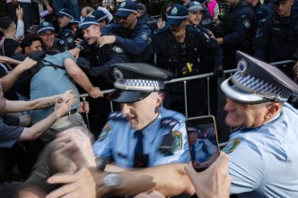 'Punched him in the head': Protest outcry