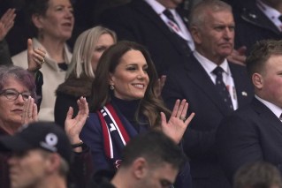 Kate enjoys rugby after bruising week for royals