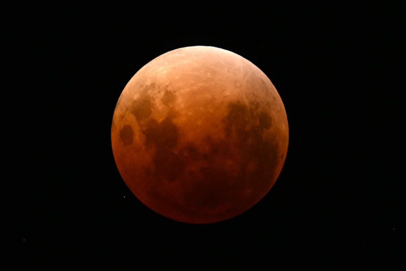 The eclipse was particularly visible in the clear skies above Brisbane. <i>Photo: AAP</i>