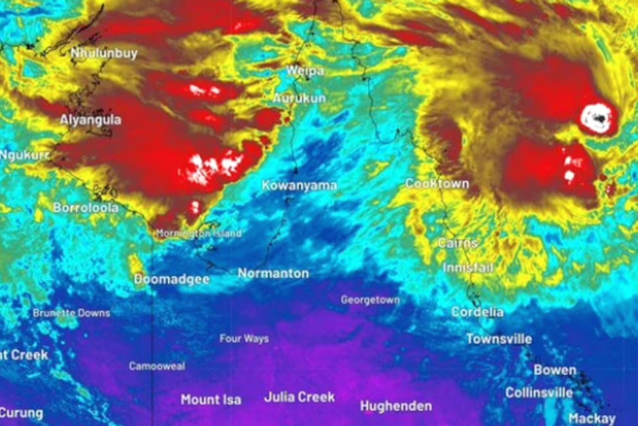 Forecasters split on risk as Qld coast braces for potential cyclone