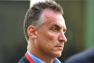 Media boss skips court in person on assault charges