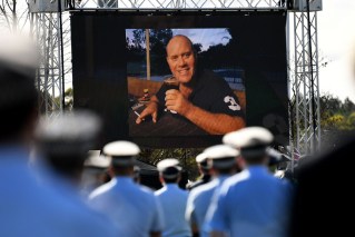 Women to face separate trials over officer's death