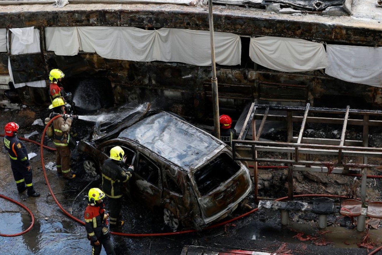 Eyewitnesses say a train struck a bus as it was crossing railway tracks in Bangkok.