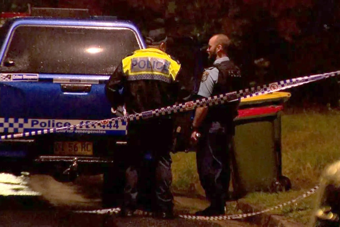 Police charged a man after three bodies were found in a suburban home.