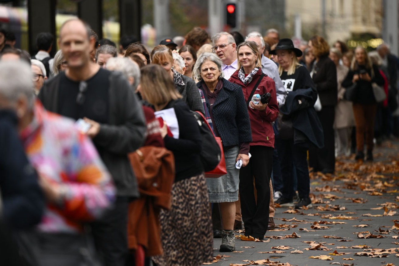 Mourners attend the public memorial for James Valentine at Sydney's Town Hall. <i>Photo: AAP</i>