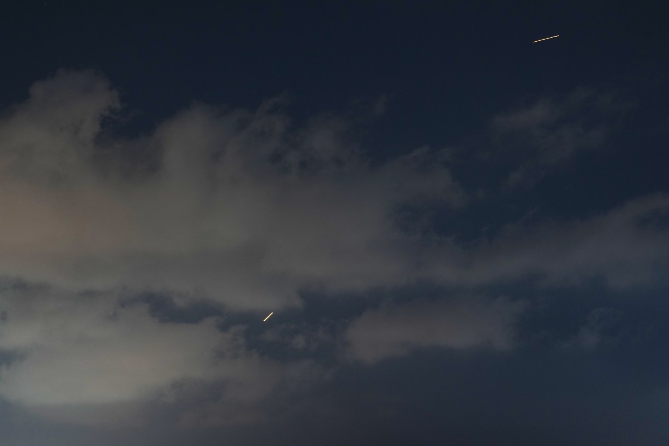 Iran says it launched missiles at Israel in response to Israeli attacks on Lebanon's capital Beirut.
