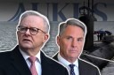 Subs funding boost while lid on AUKUS debate