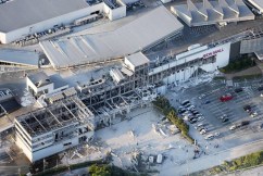 Collapsed buildings in powerful Japan quake, mall blast