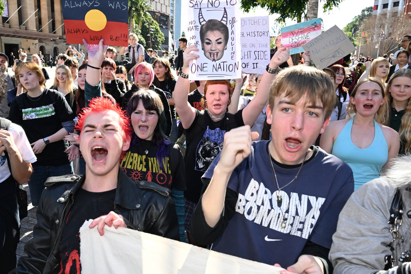 High school and university students rally at Brisbane's King George Square.