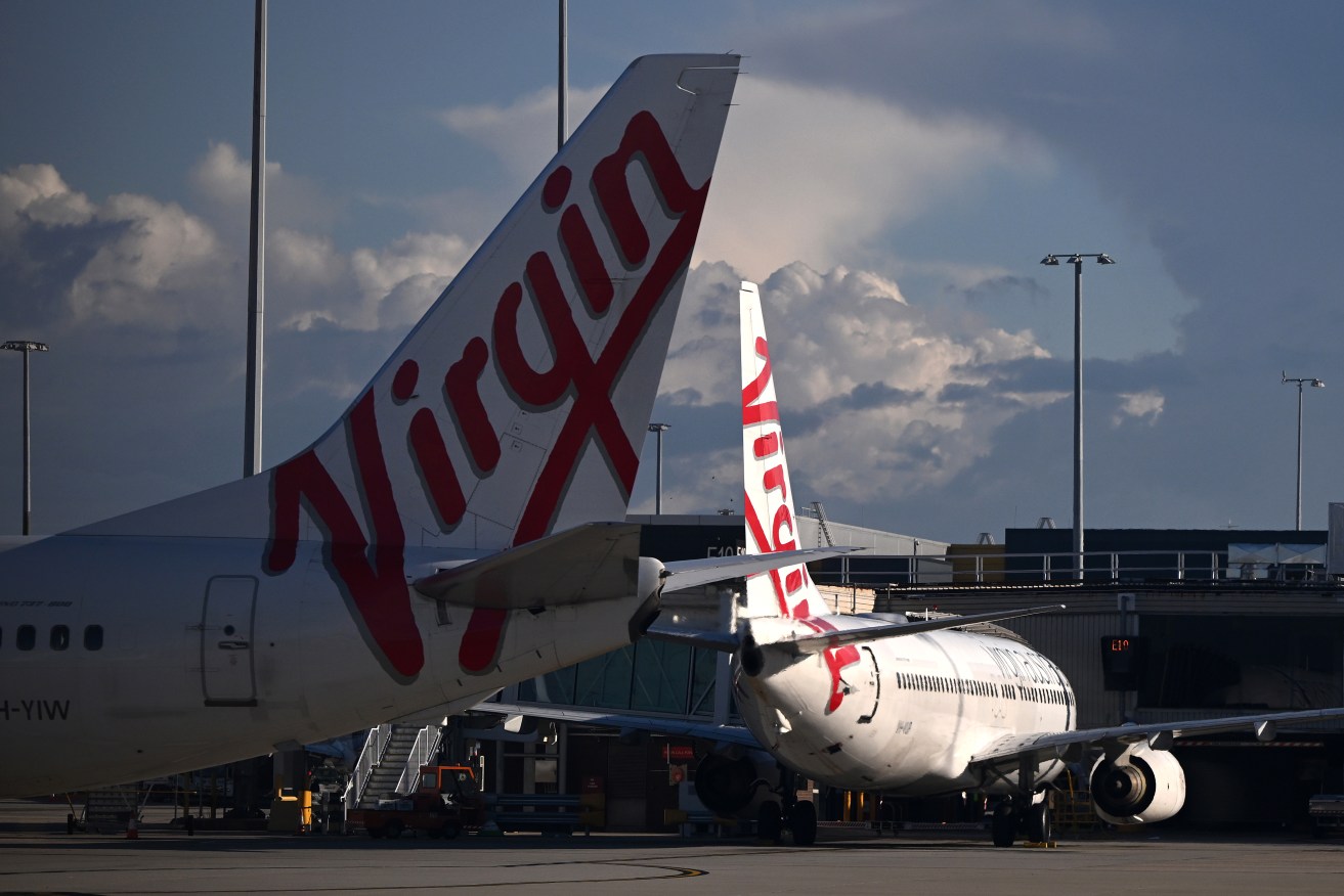 A Virgin Australia plane was cleared for take-off at the same time as a Qantas jet.