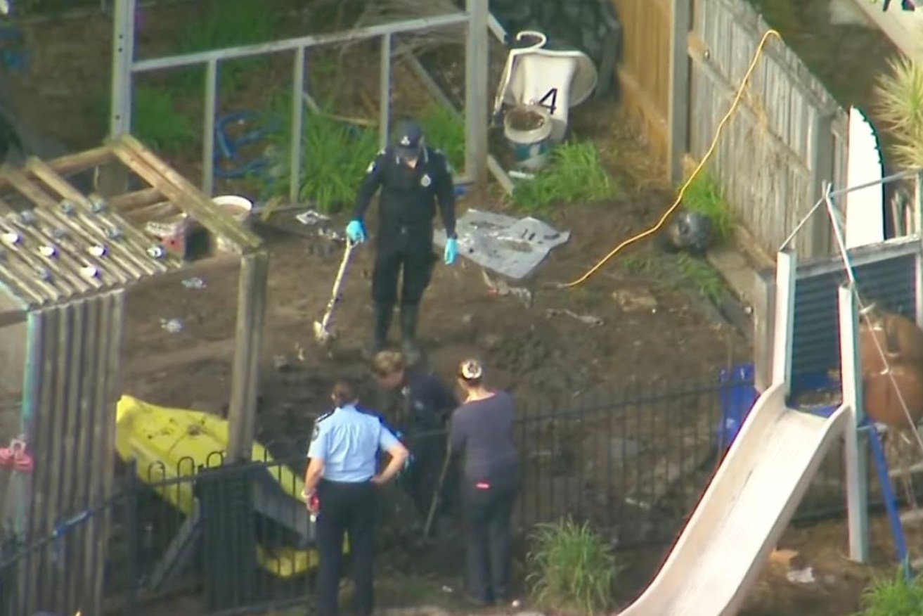 Police searched a backyard near Brisbane on Monday.