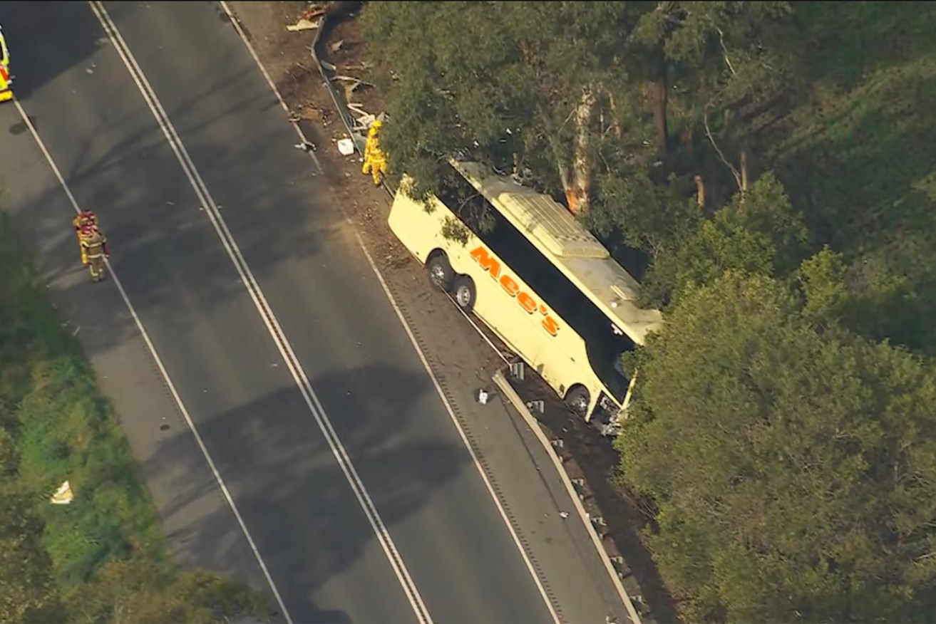 A woman is dead and many others injured after a three-vehicle crash involving a bus in Victoria.