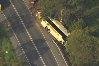 One dead, scores injured in bus crash on rural highway