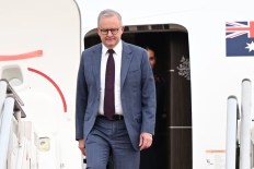PM leaves grim domestic scene as he flies to Pacific