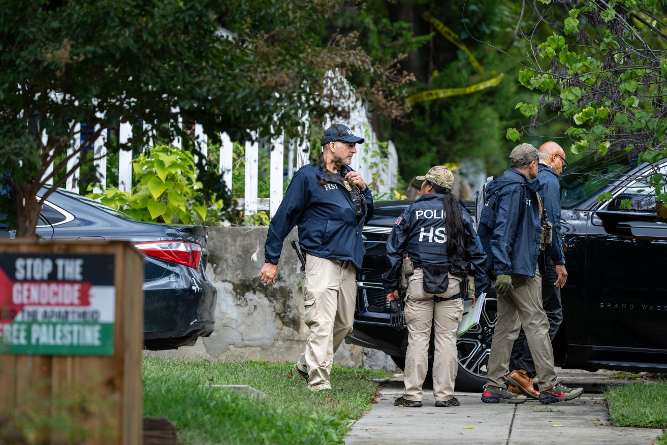 Homeland Security officers leave the Washington residence of Ilhan Omar.