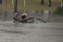Man rescued as record rain slams south-east Qld