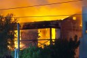 Teen arrested over fire that trapped elderly woman